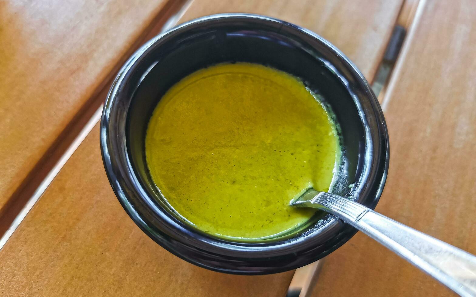 Green spicy Mexican sauce in a restaurant Puerto Escondido Mexico. photo