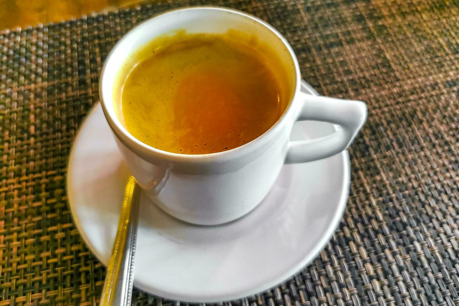 Cup of americano black coffee in restaurant Mexico. photo