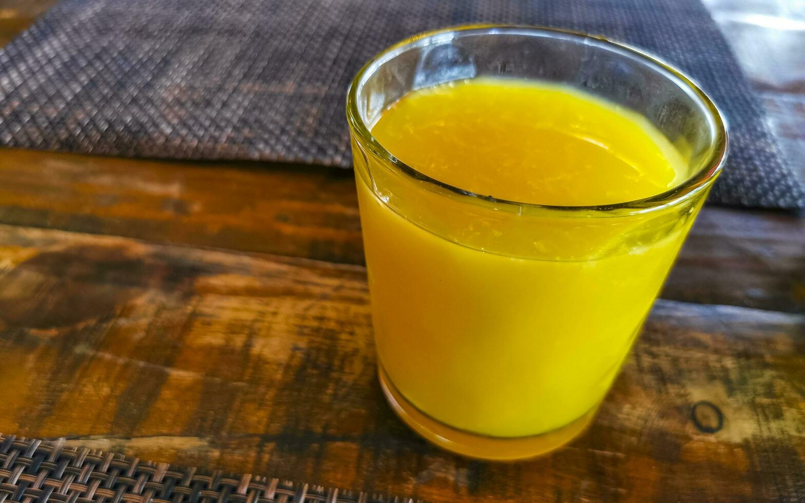 Orange fruit juice in restaurant PapaCharly Playa del Carmen Mexico. photo