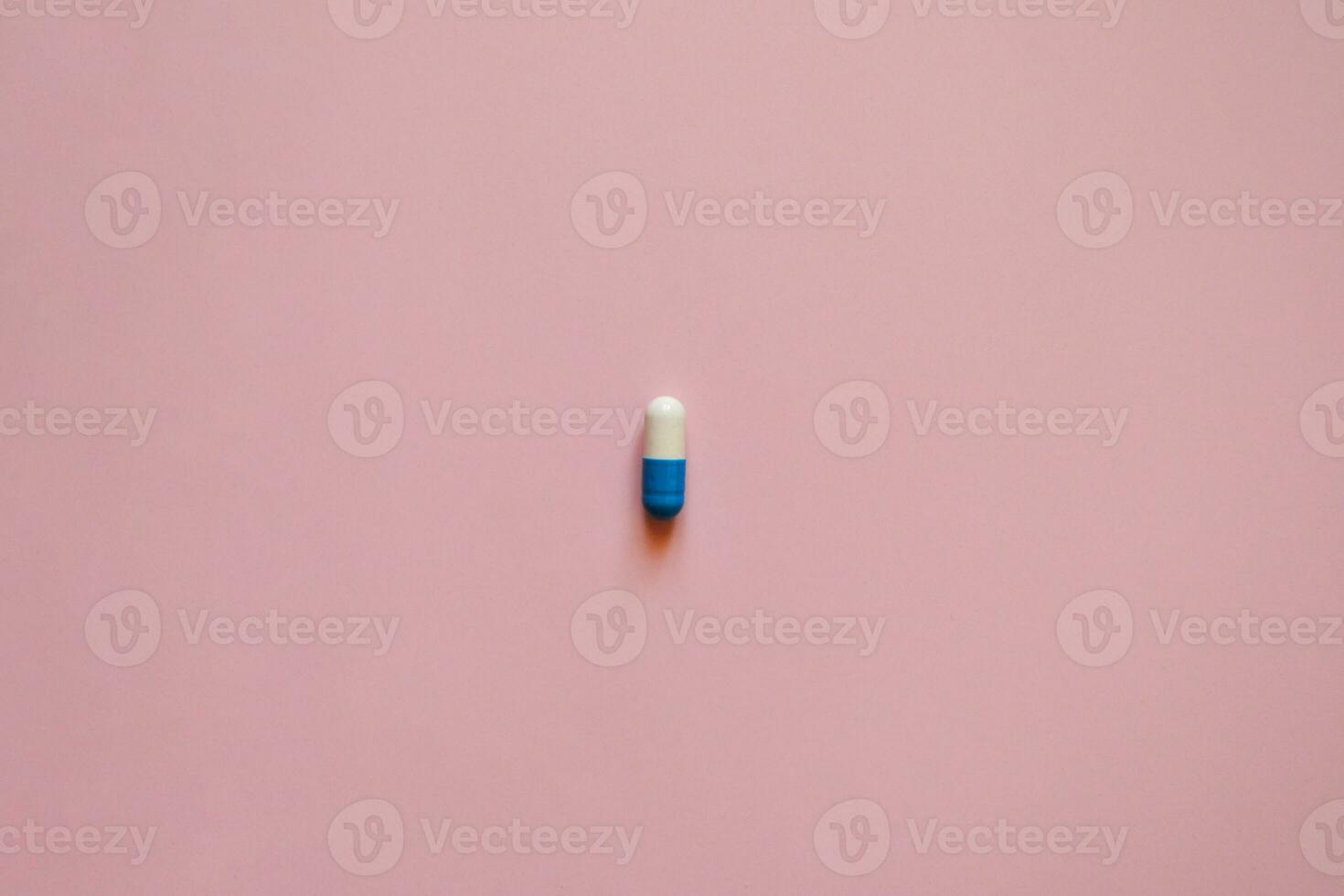 pill capsule on a pink background, medication, day of the medical worker, medical care, banner for the hospital photo