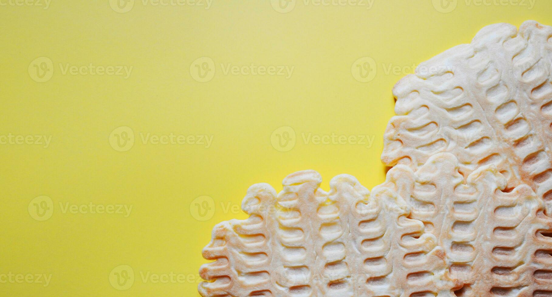 waffles on a yellow background, belgian waffles, homemade pastries, a place for text, a banner for a bakery photo