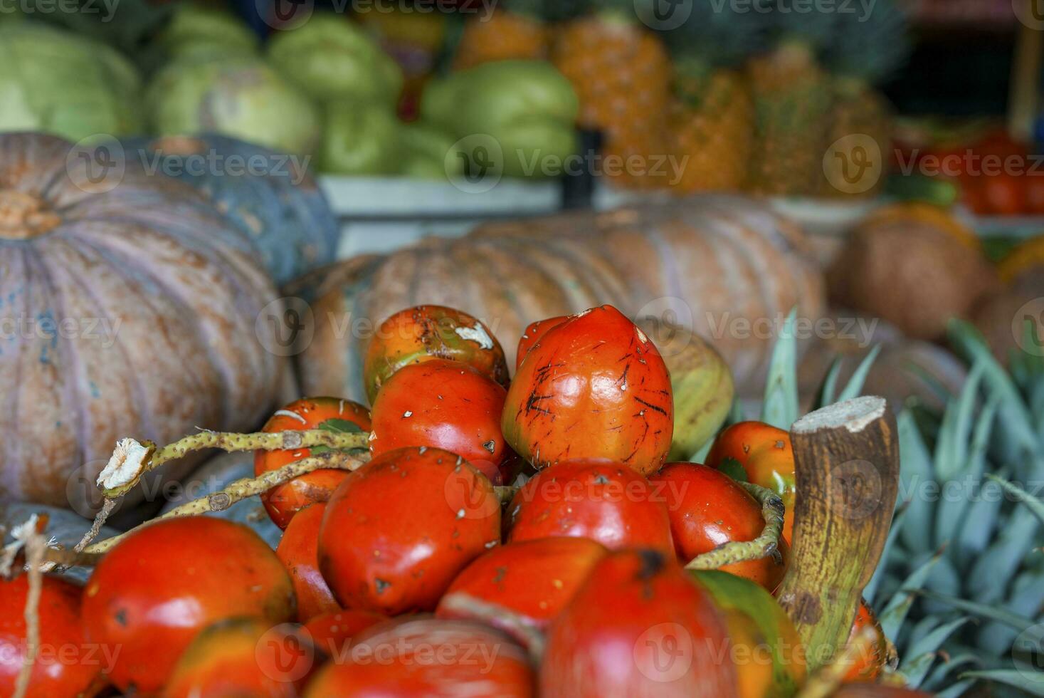 Tropical fresh ripe pejibaye fruits for sale on souvenirs stand in market photo