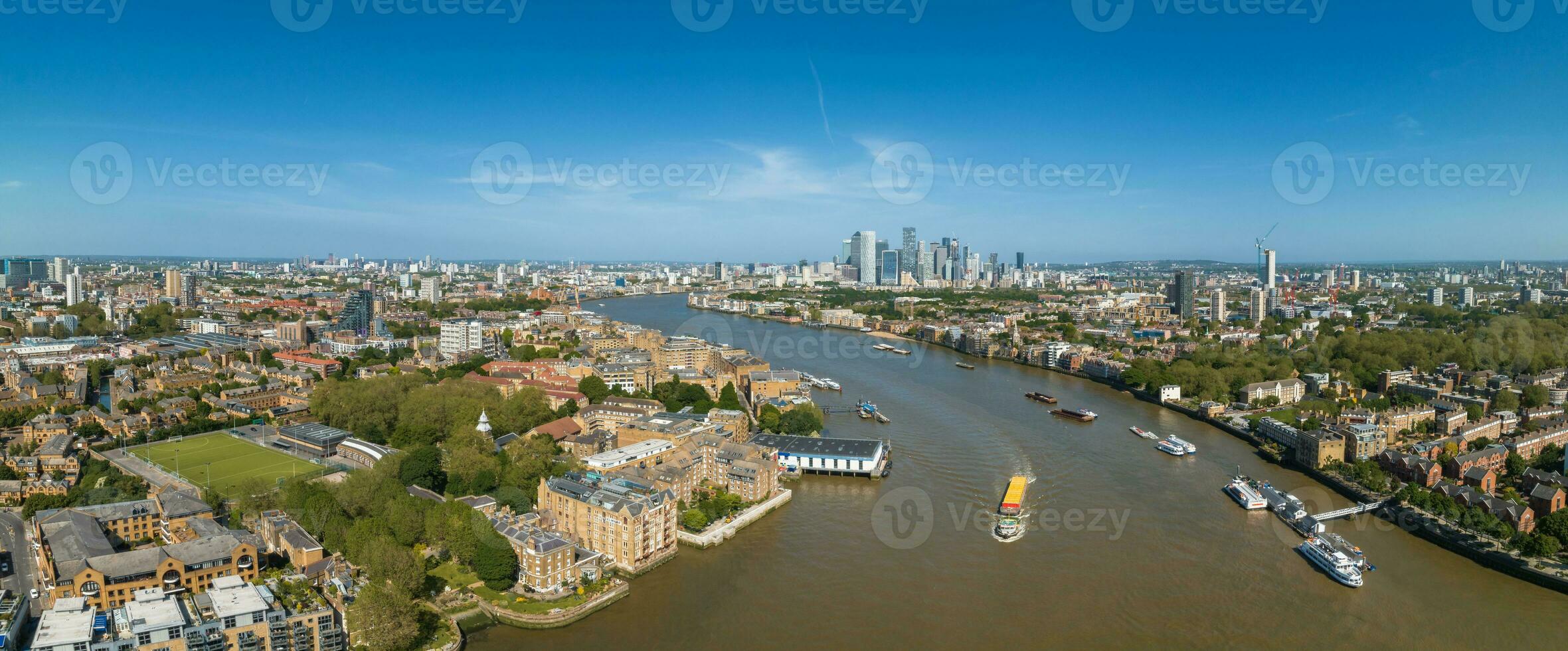 Beautiful panoramic view of London Thames river with Canary Wharf skyline on the horizon. photo