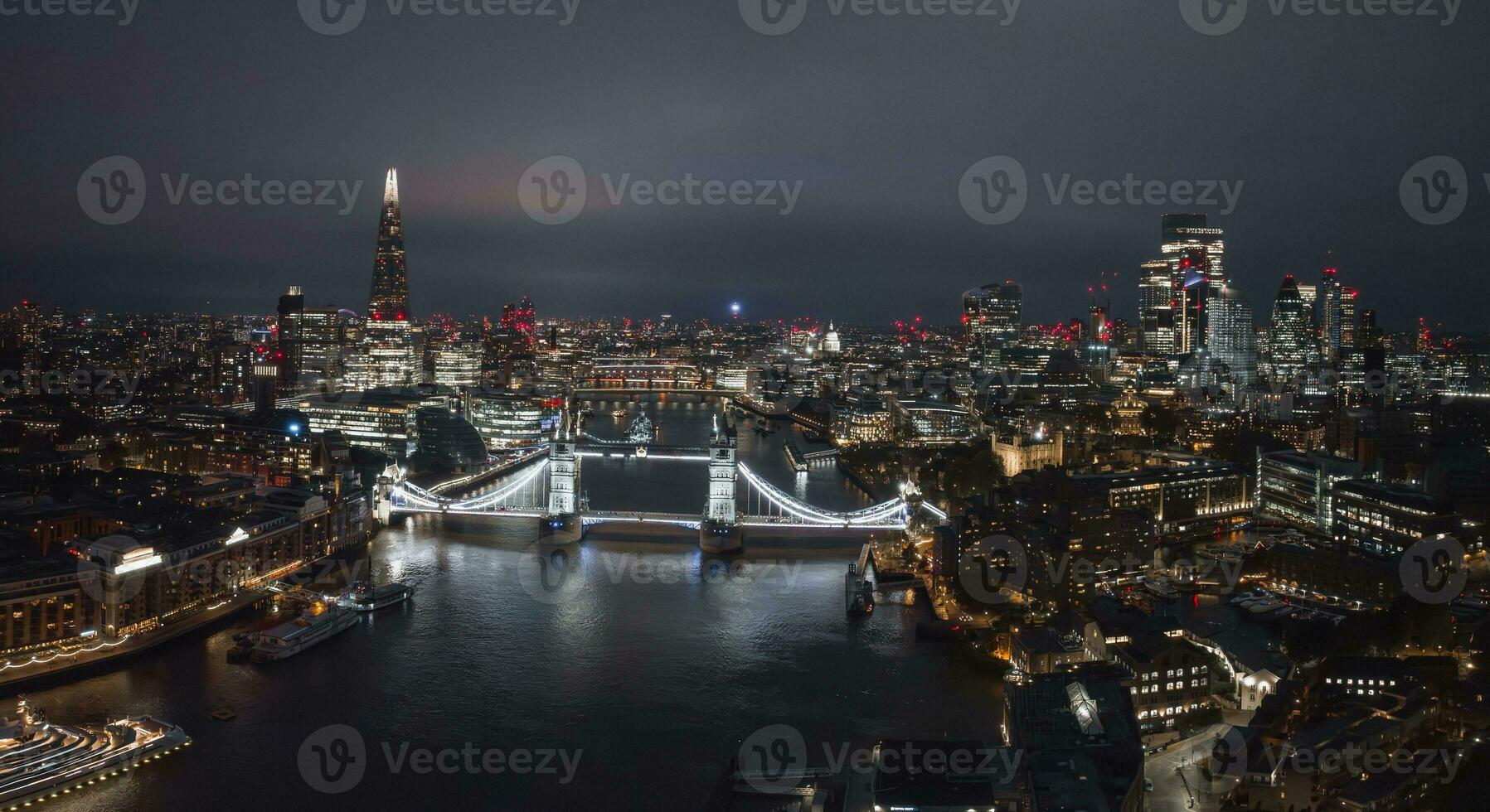 Aerial night view of the Tower Bridge in London. photo