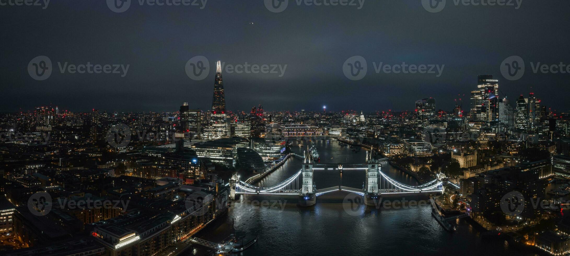 Aerial night view of the lifting up Tower Bridge in London. photo