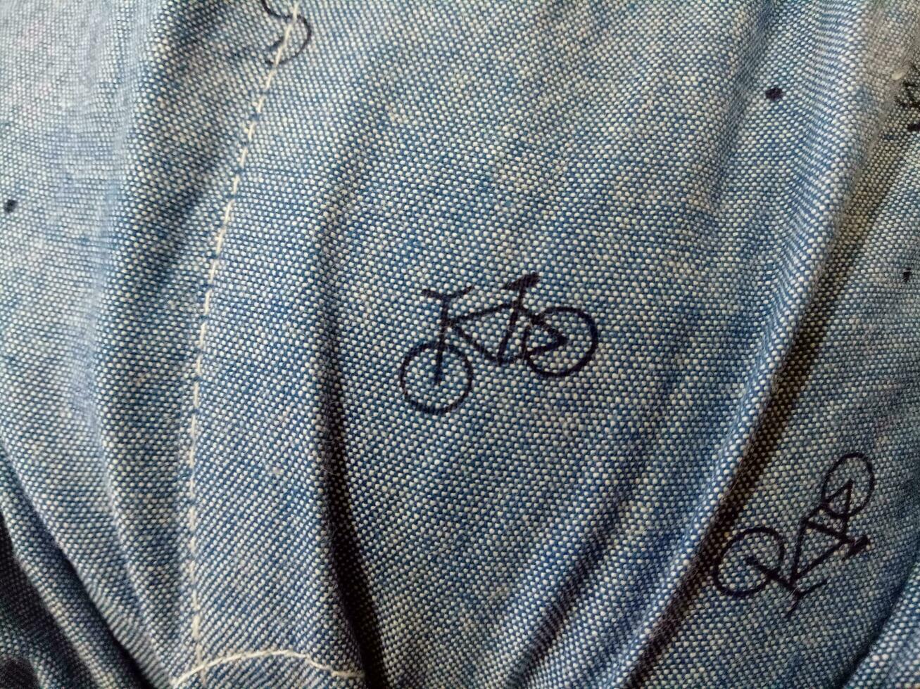 Photo of a gray cloth texture with a bicycle image