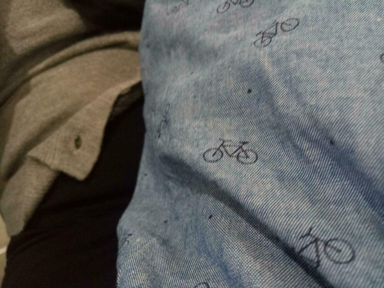 Photo of a gray cloth texture with a bicycle image