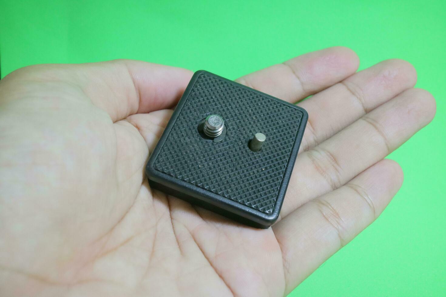 Square tripod mounting for camera in black color photo