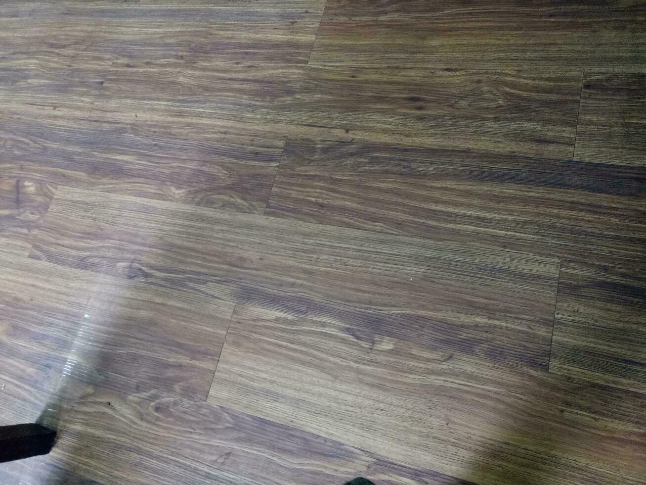 Photo of a floor with a thin layer of wood