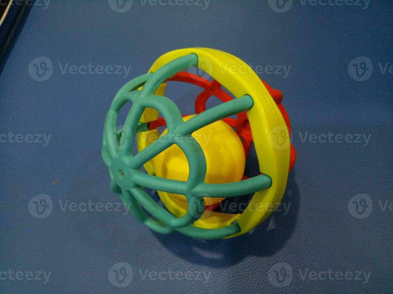 Ball toy with colorful plastic spokes with a loud sound for babies photo