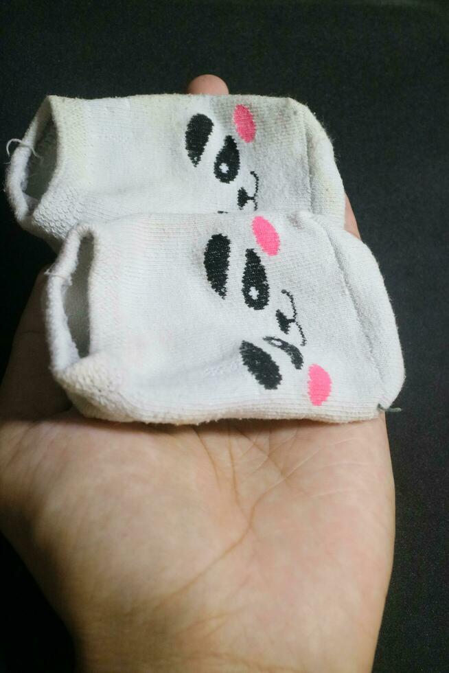 Cute baby socks with panda faces photo