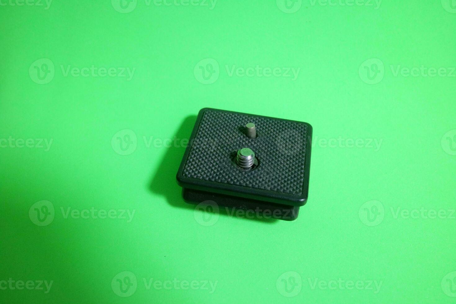 Square tripod mounting for camera in black color photo