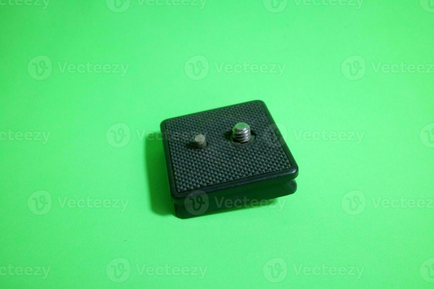 Square tripod mounting for camera in black color photo