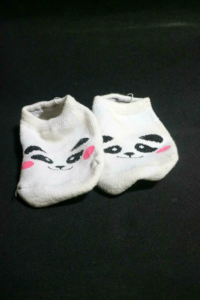 Cute baby socks with panda faces photo