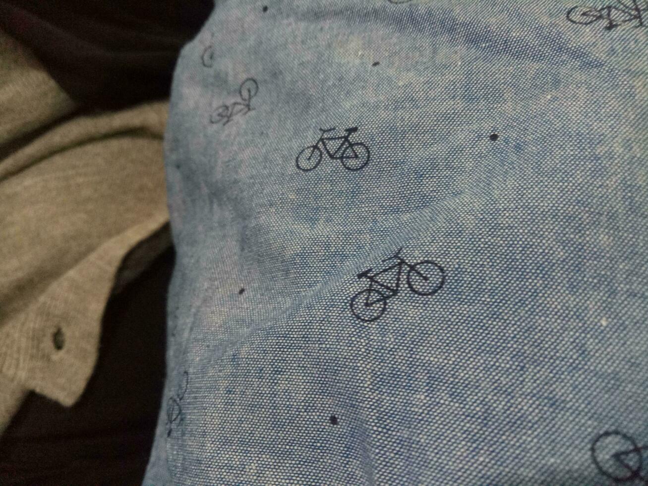 Photo of a gray cloth texture with a bicycle image