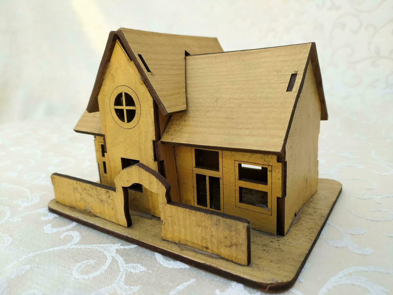 Miniature old house made of wood photo