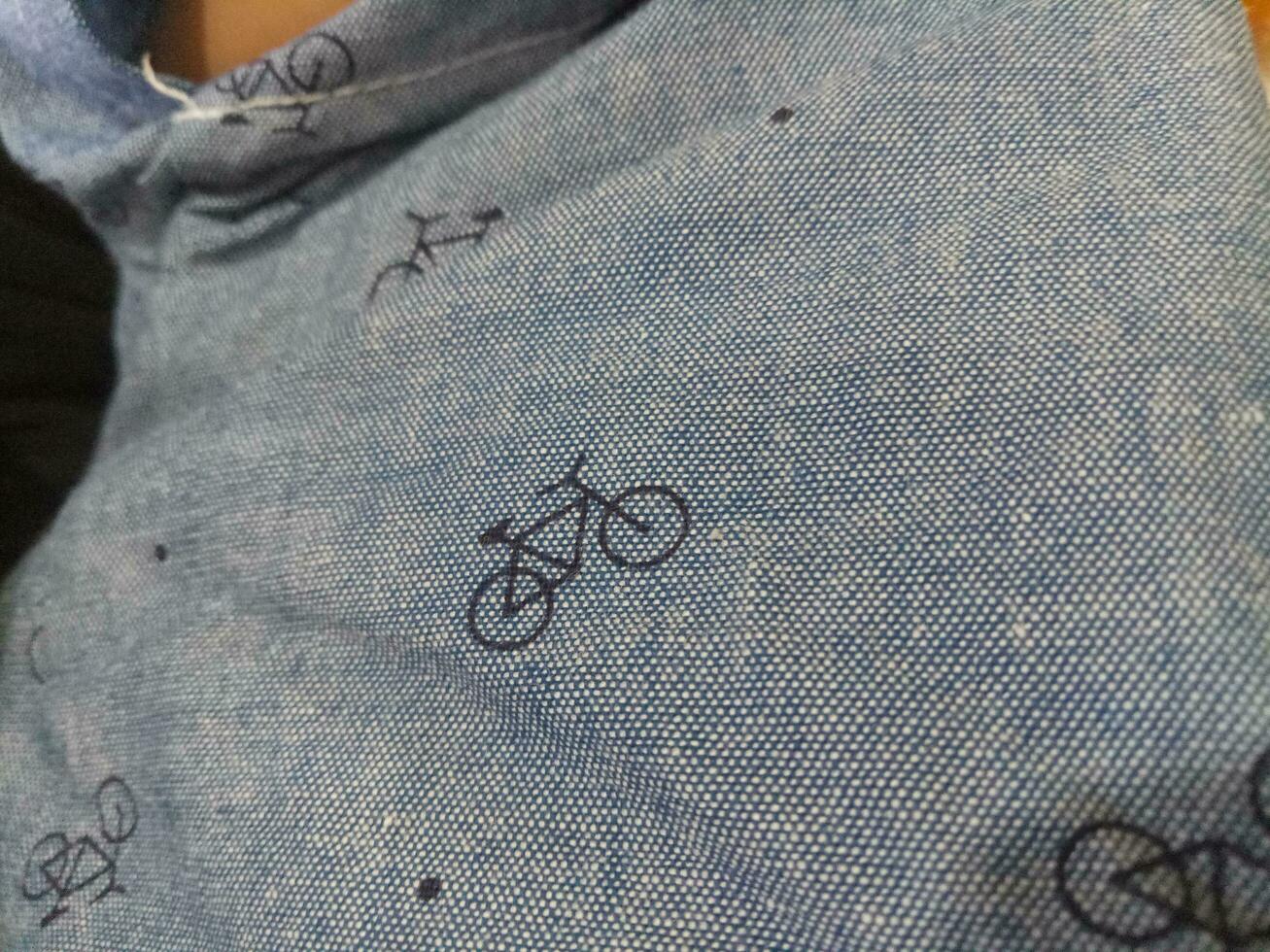 Photo of a gray cloth texture with a bicycle image