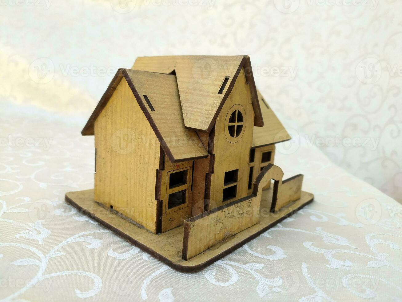 Miniature old house made of wood photo