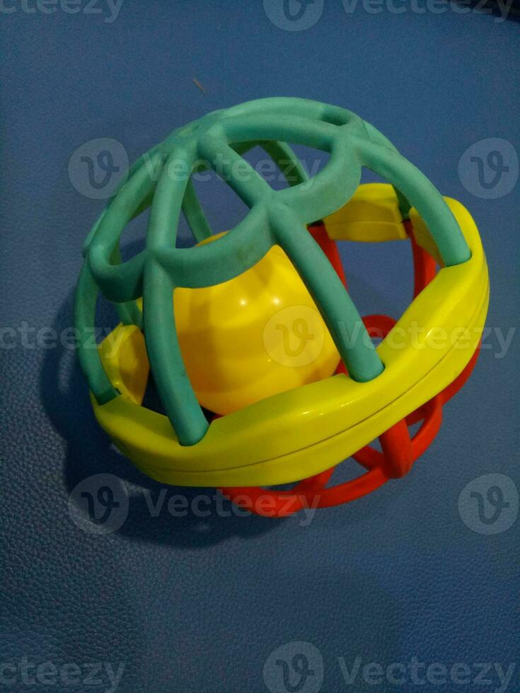 Ball toy with colorful plastic spokes with a loud sound for babies photo