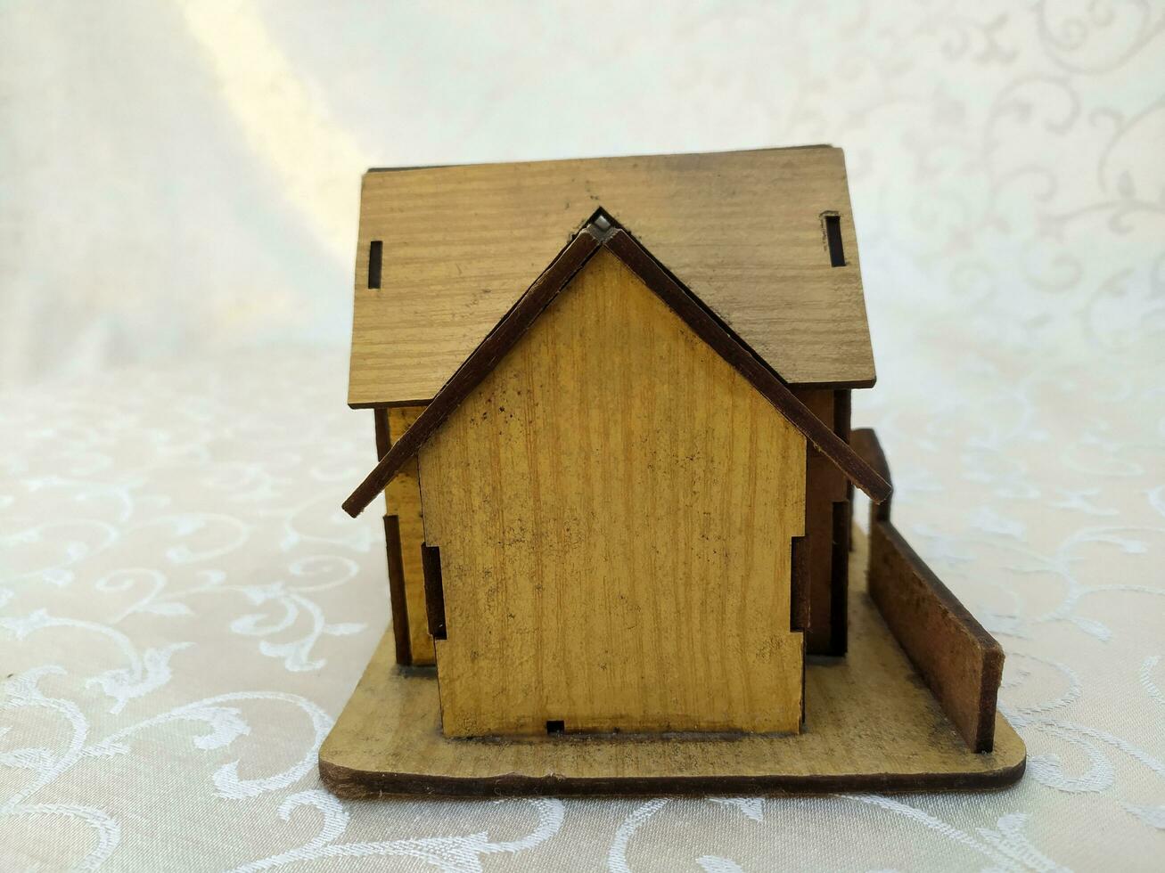 Miniature old house made of wood photo