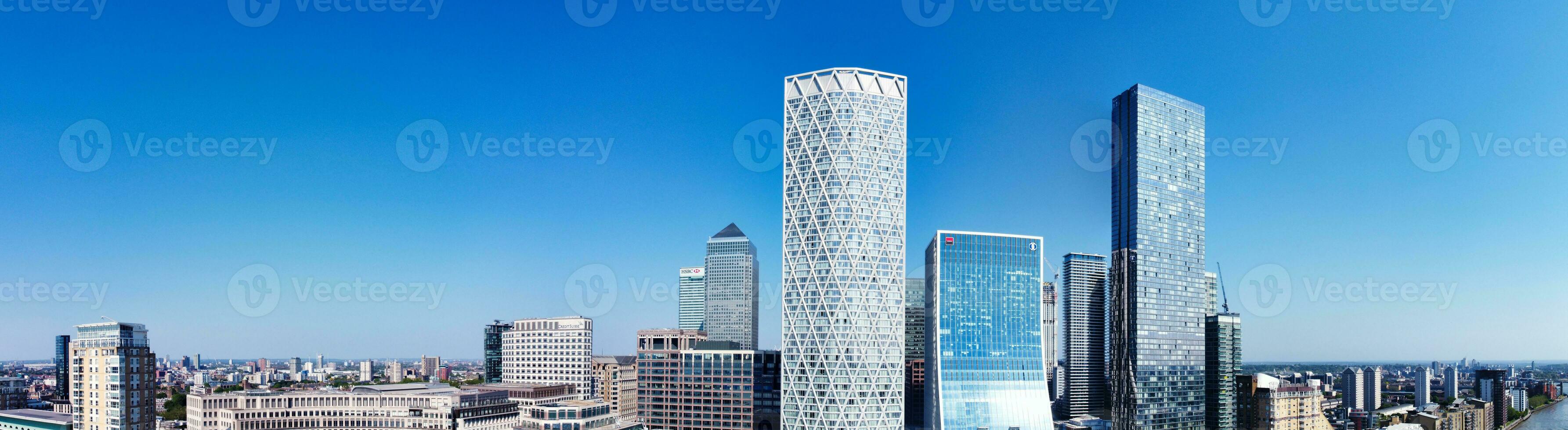 High Angle Panoramic View of Canary Wharf Buildings at Central London City of England Great Britain. The Footage Was Captured with Drone's Camera at Low Altitude on 08-June-2023 During Sunset. photo