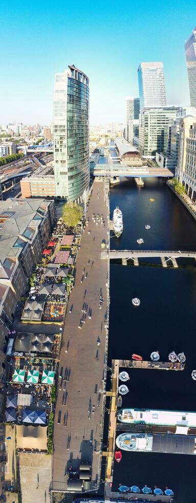 High Angle Panoramic View of Canary Wharf Buildings at Central London City of England Great Britain. The Footage Was Captured with Drone's Camera at Low Altitude on 08-June-2023 During Sunset. photo