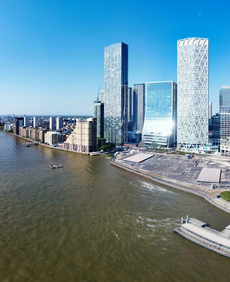 High Angle Panoramic View of Canary Wharf Buildings at Central London City of England Great Britain. The Footage Was Captured with Drone's Camera at Low Altitude on 08-June-2023 During Sunset. photo