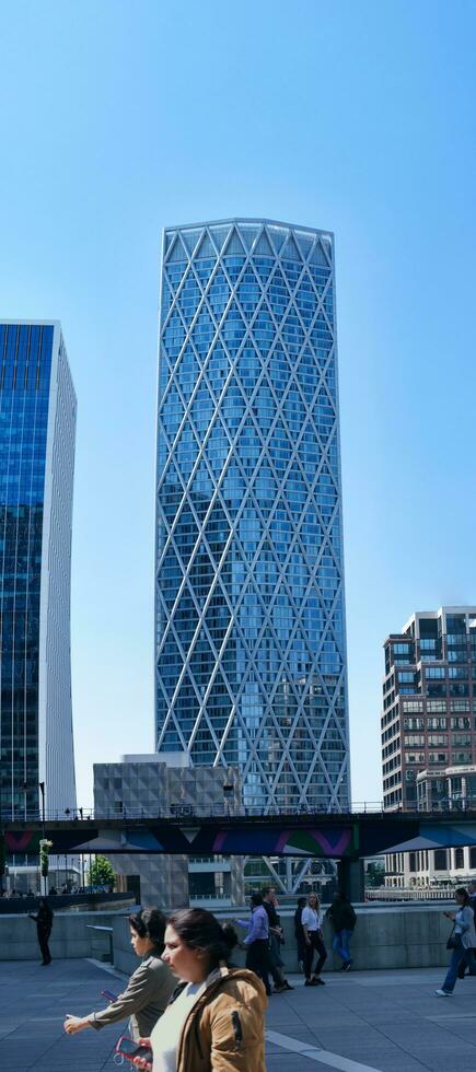 Low Angle Panoramic View of Canary Wharf Buildings at Central London City of England Great Britain. The Footage Was Captured on 08-June-2023 During Clear Day. photo