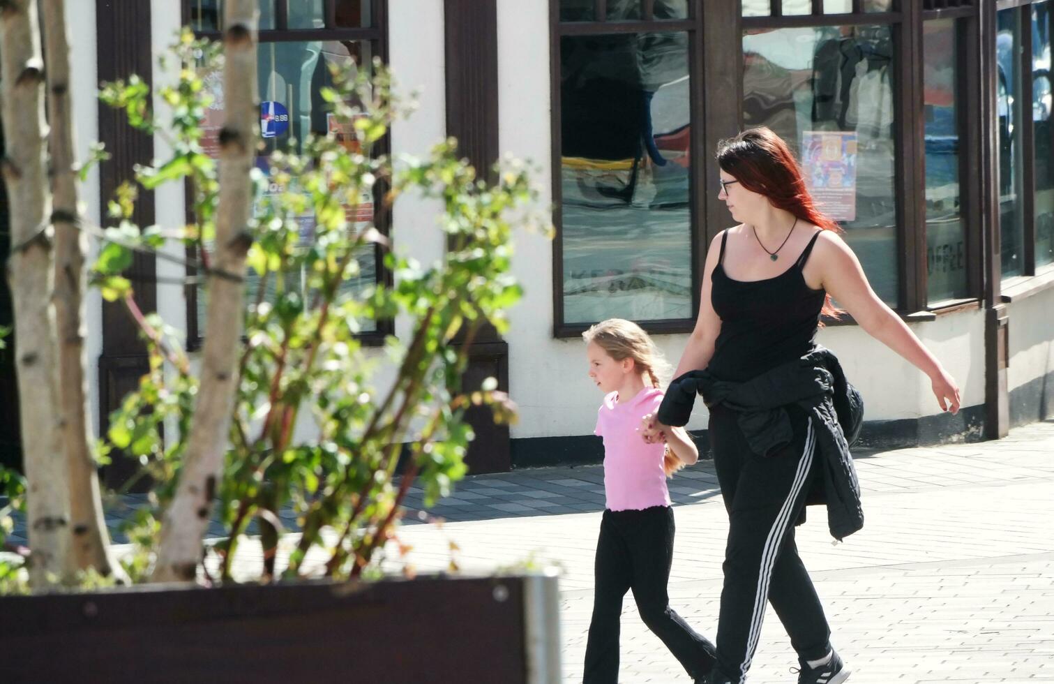 Beautiful Image of People at The Mall Shopping Centre Downtown of Central Luton City of England Great Britain for Shopping and Walking. The Image Was Captured on 02-June 2023 photo