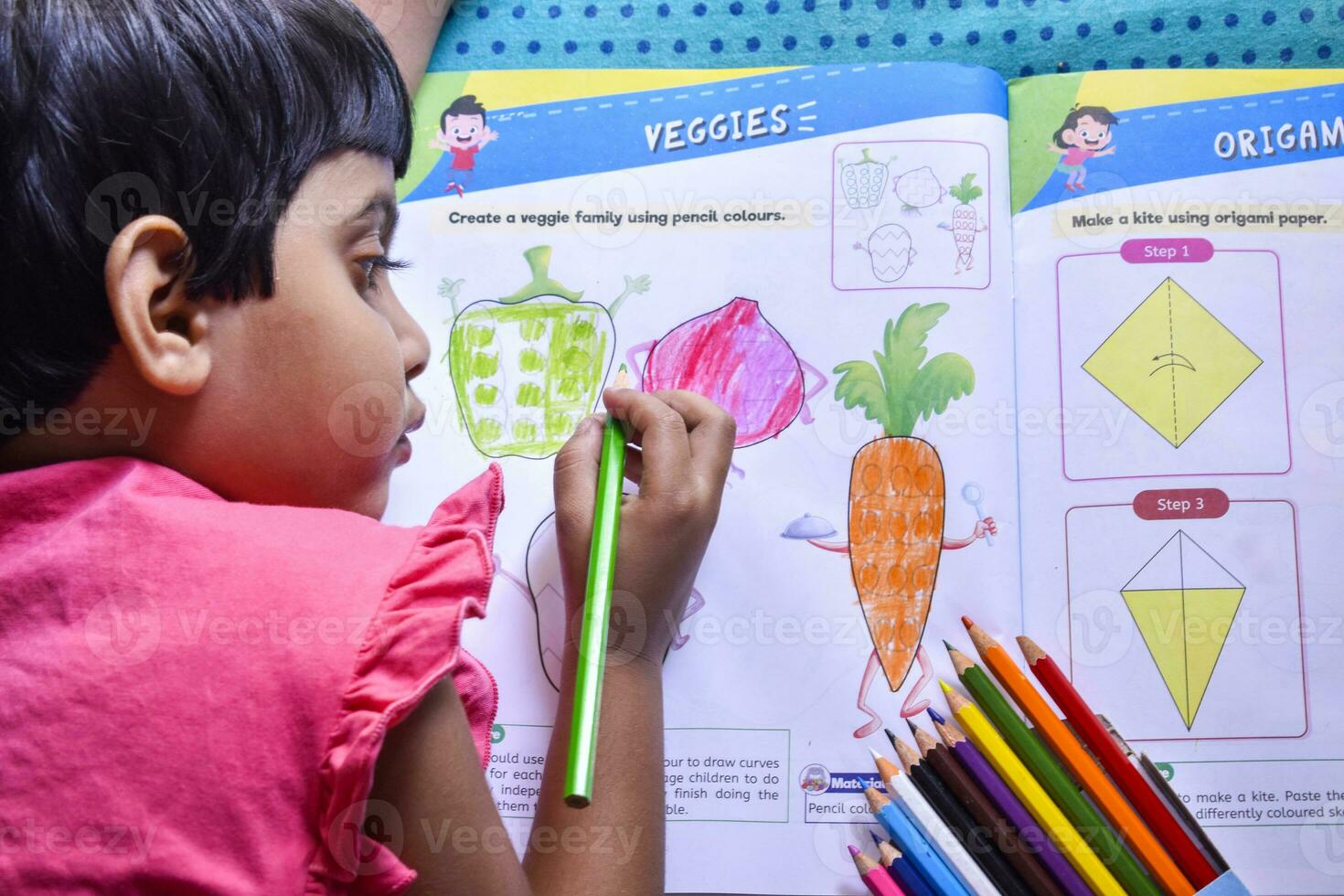 Kids engrossed in drawing, exploring creativity and expressing themselves in their art book photo