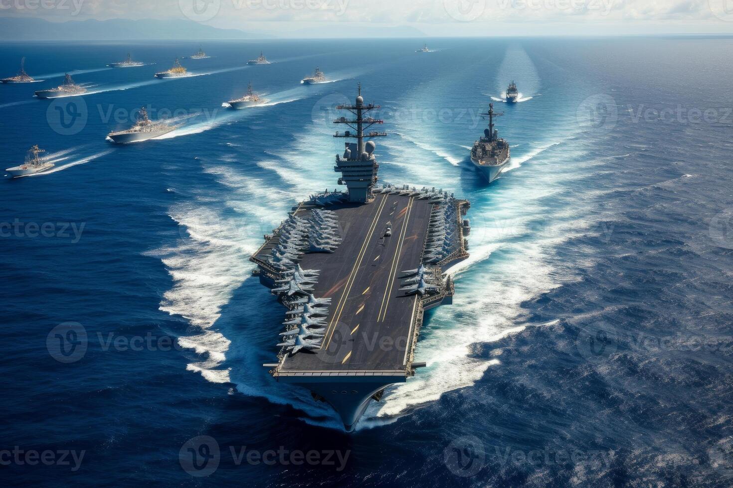 Fleet of navy ships sailing in the blue ocean waters. photo