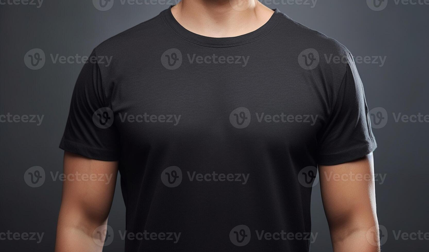 Powerful presence, strong man showcasing black t-shirt mockup on gray background photo