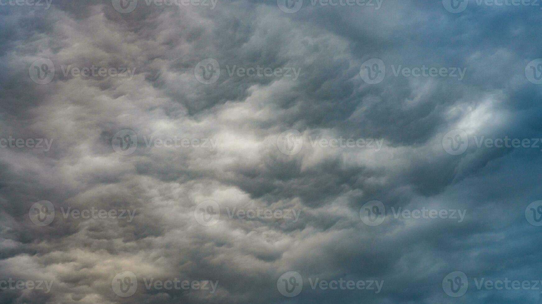 Texture of bright blue dramatic cloudy sky. photo
