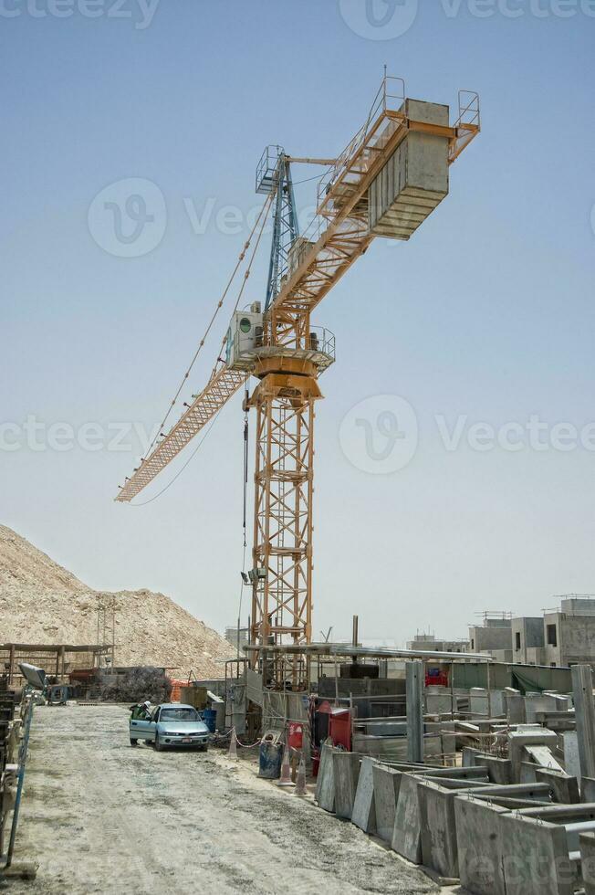 Construction site with cranes.Biton constructions photo