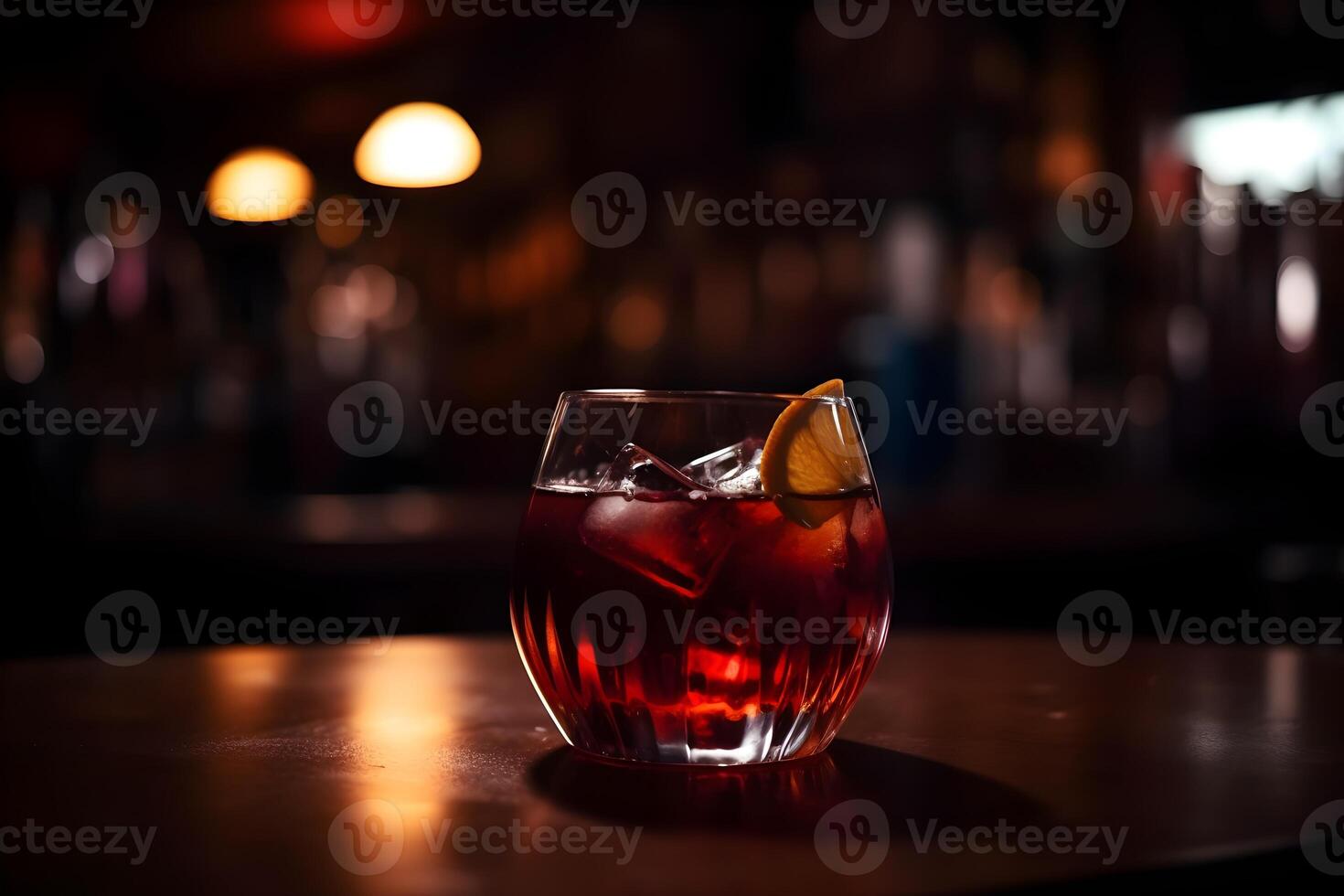 cocktail in the bar with a slice of lemon and a straw. photo