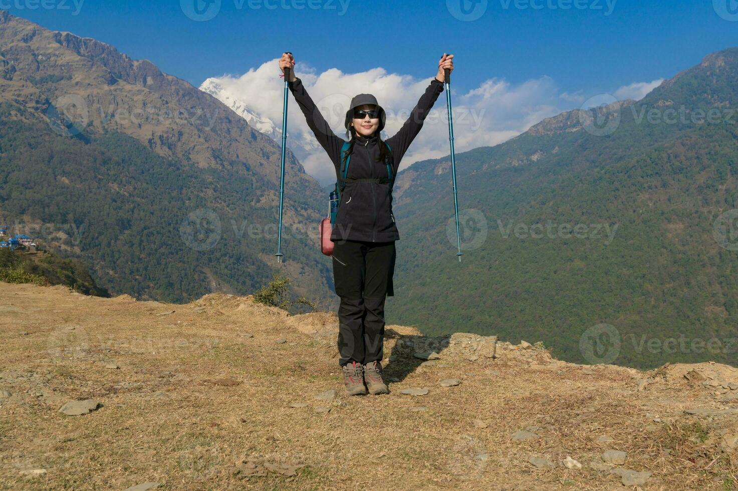 A young traveller trekking on forest trail , Nepal photo