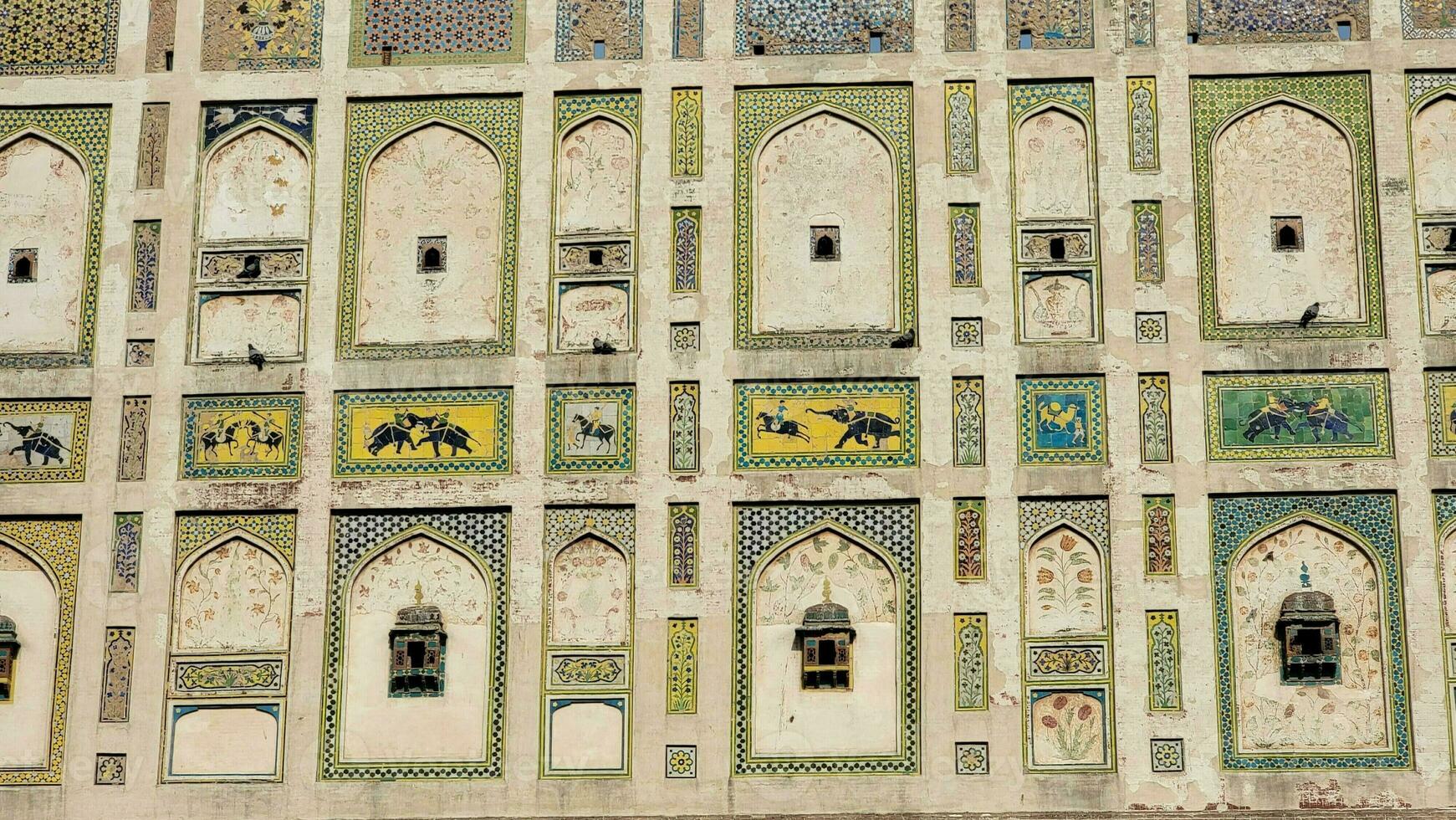 The conserved picture wall in Badshahi fort close picture of wall texture photo