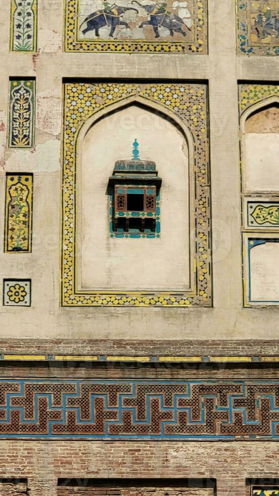 The conserved picture wall in Badshahi fort close picture of wall texture photo