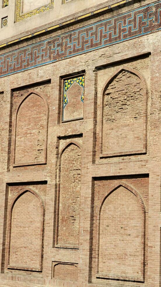 The conserved picture wall in Badshahi fort close picture of wall texture photo
