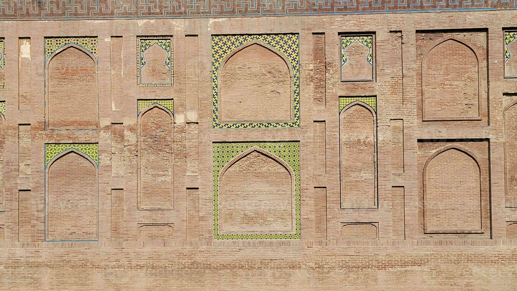 The conserved picture wall in Badshahi fort close picture of wall texture photo