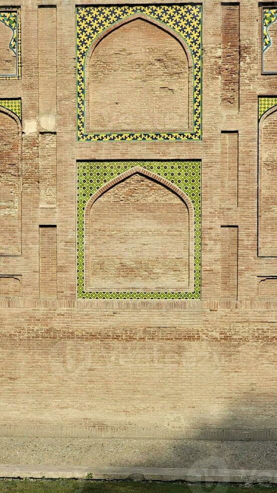 The conserved picture wall in Badshahi fort close picture of wall texture photo