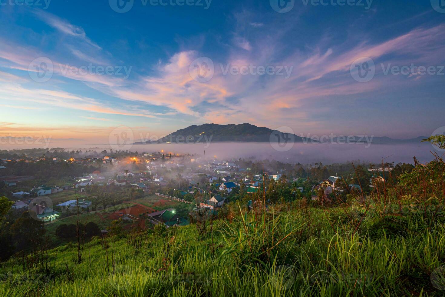 Mountains during dawn. Beautiful natural landscape in the summer time with fog photo