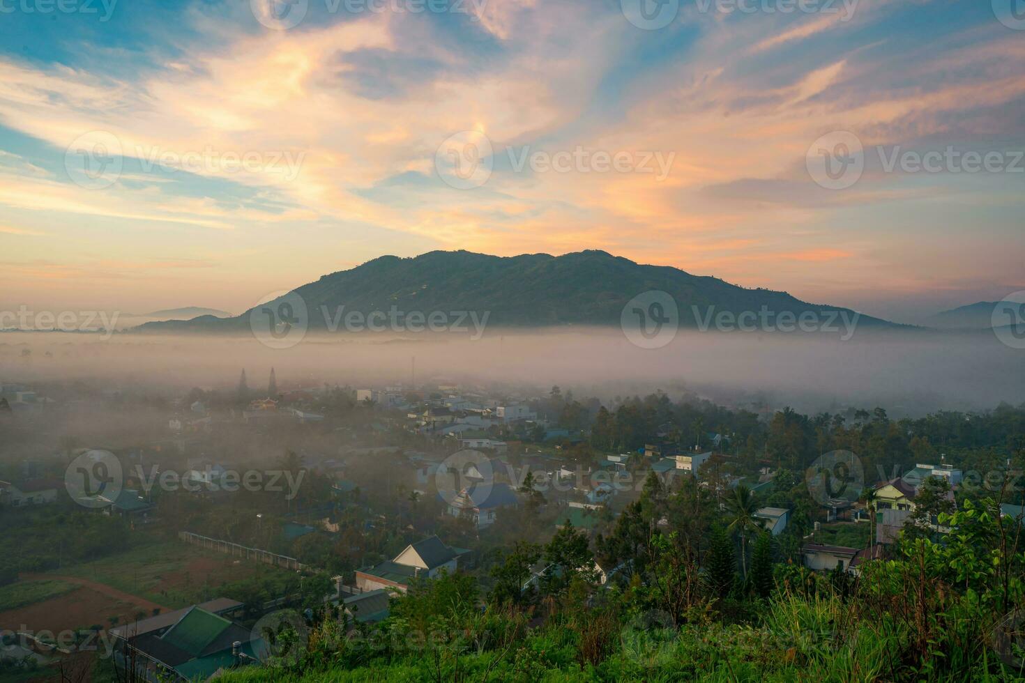 Mountains during dawn. Beautiful natural landscape in the summer time with fog photo