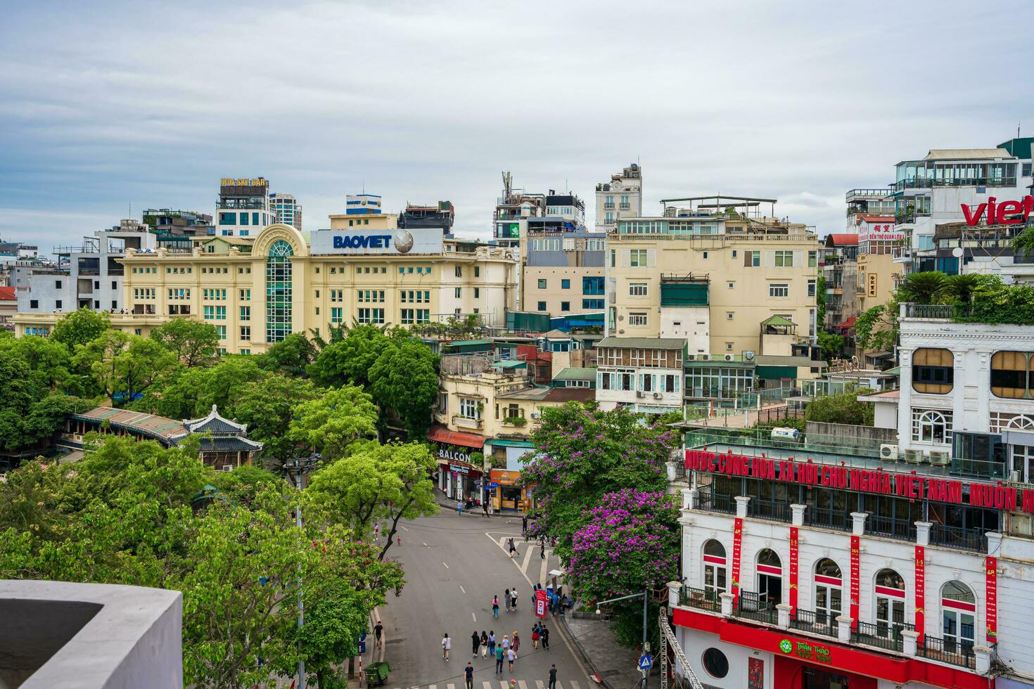 Hanoi, Viet Nam - 13 May 2023 Aerial view of Hoan Kiem Lake  Ho Guom or Sword lake in the center of Hanoi in the fog in the morning. Hoan Kiem Lake is a famous tourist place in Hanoi. Travel concept photo