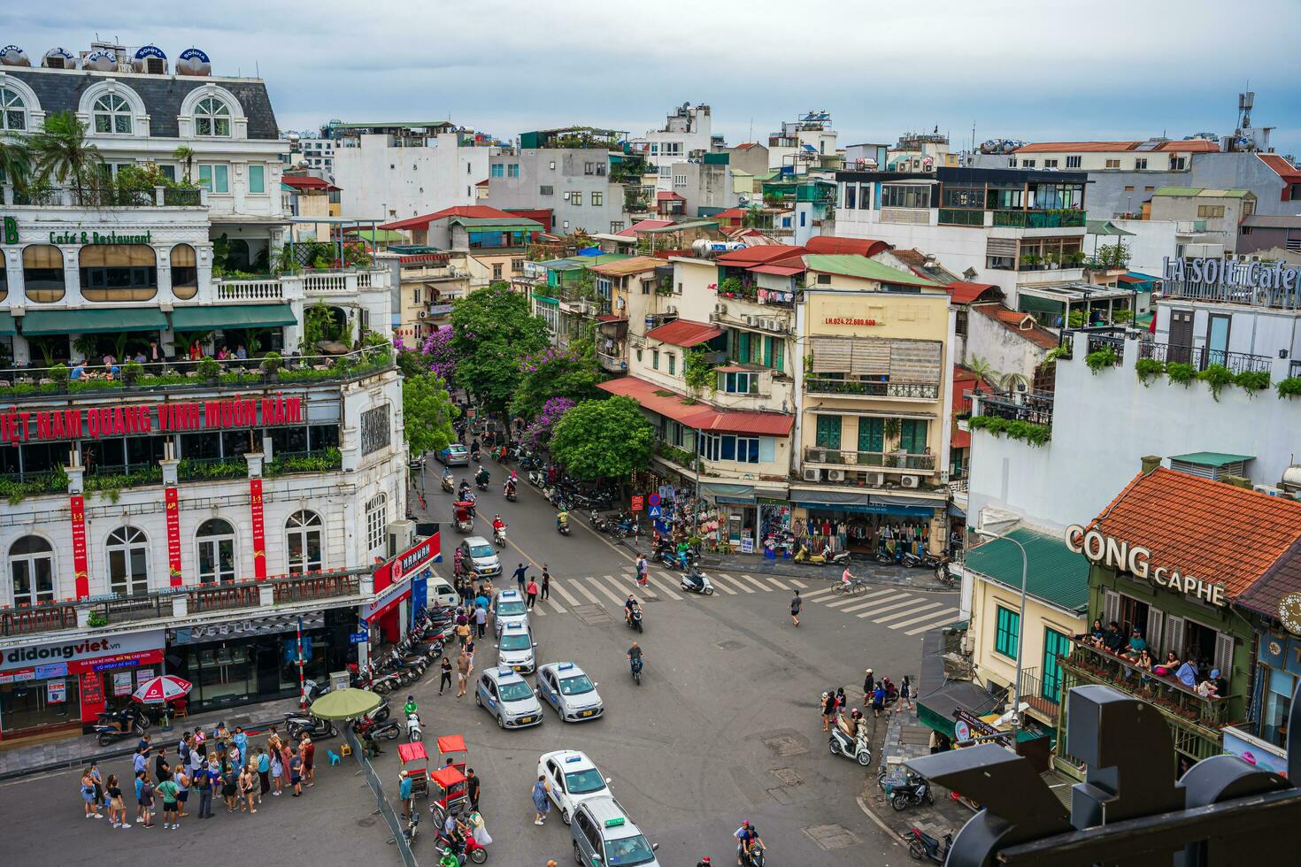 Hanoi, Viet Nam - 13 May 2023 Aerial view of Hoan Kiem Lake  Ho Guom or Sword lake in the center of Hanoi in the fog in the morning. Hoan Kiem Lake is a famous tourist place in Hanoi. Travel concept photo