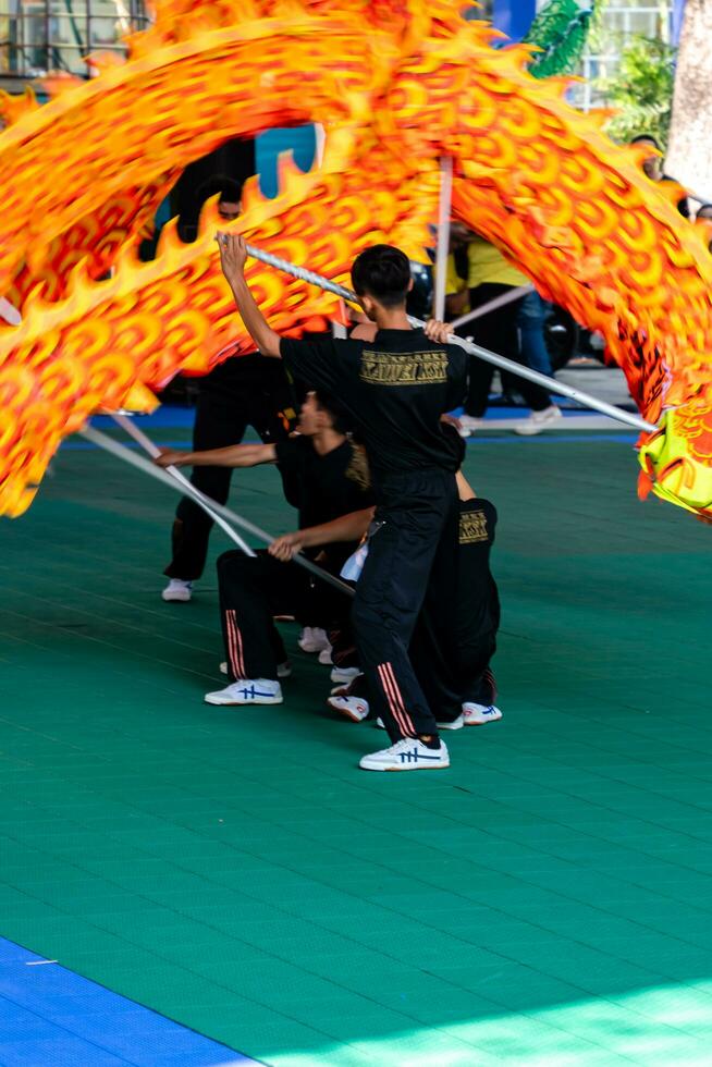 Ho Chi Minh, Viet Nam - 22 April 2023 Dragon dance, celebrate the new year. At the park photo