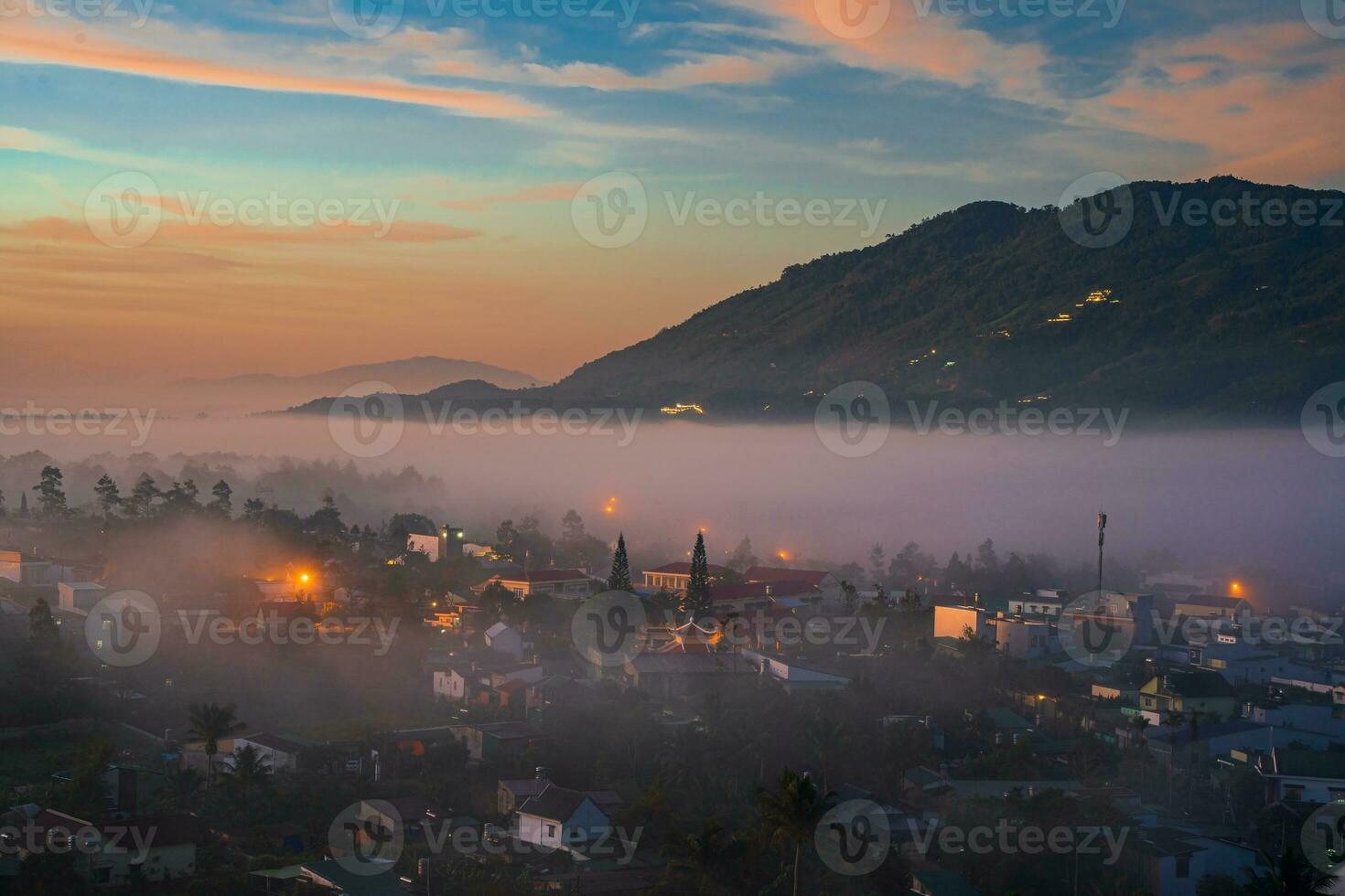 Mountains during dawn. Beautiful natural landscape in the summer time with fog photo