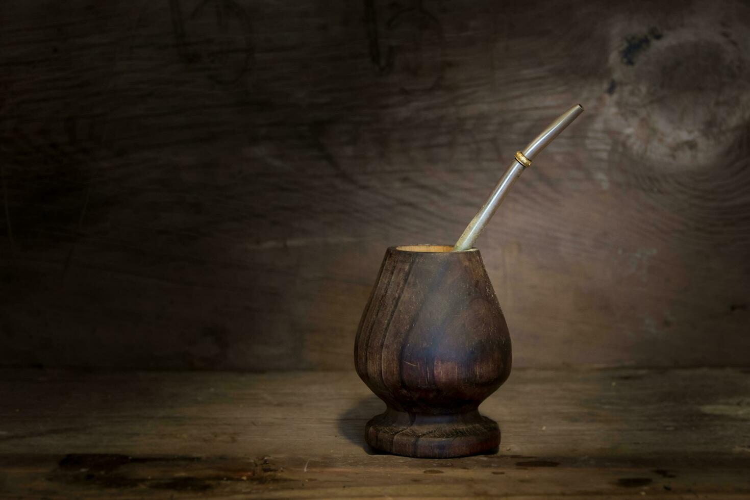 yerbamate and light bulb on rustic wooden background photo