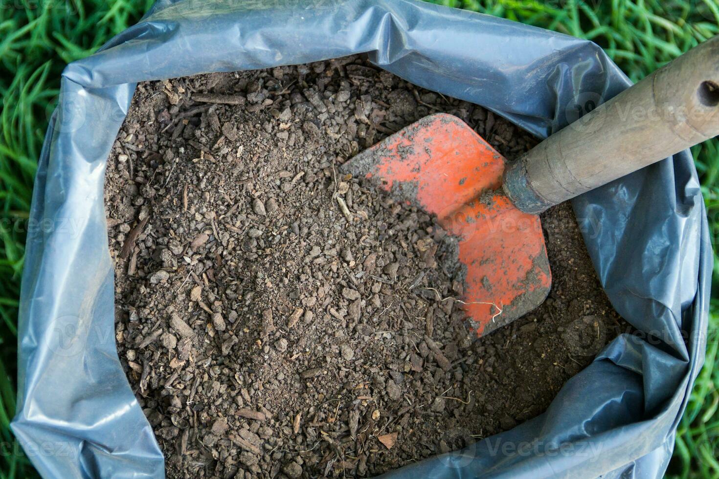 top view of a bag with fertile soil for the garden photo