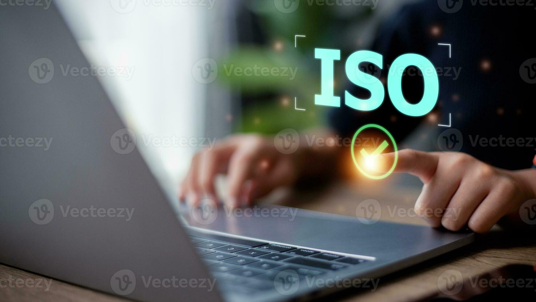 Woman presses his finger on check mark with the abbreviation ISO. ISO quality control certification concept. photo